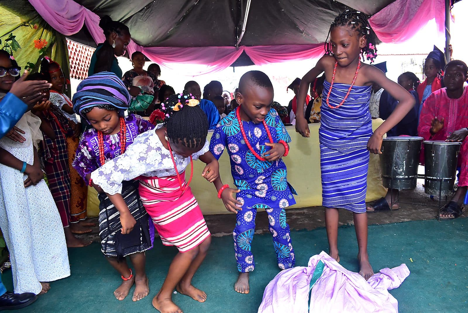 Pupils dancing in traditional dress on cultural day