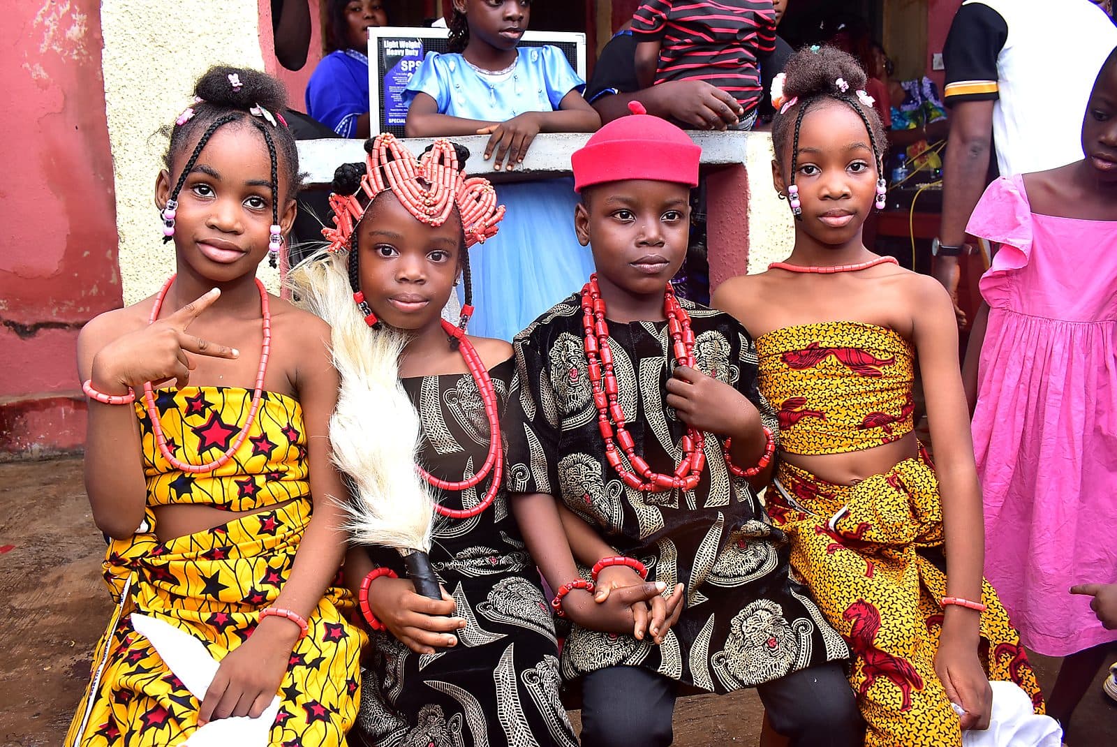 Pupils in traditional attire and coral beads