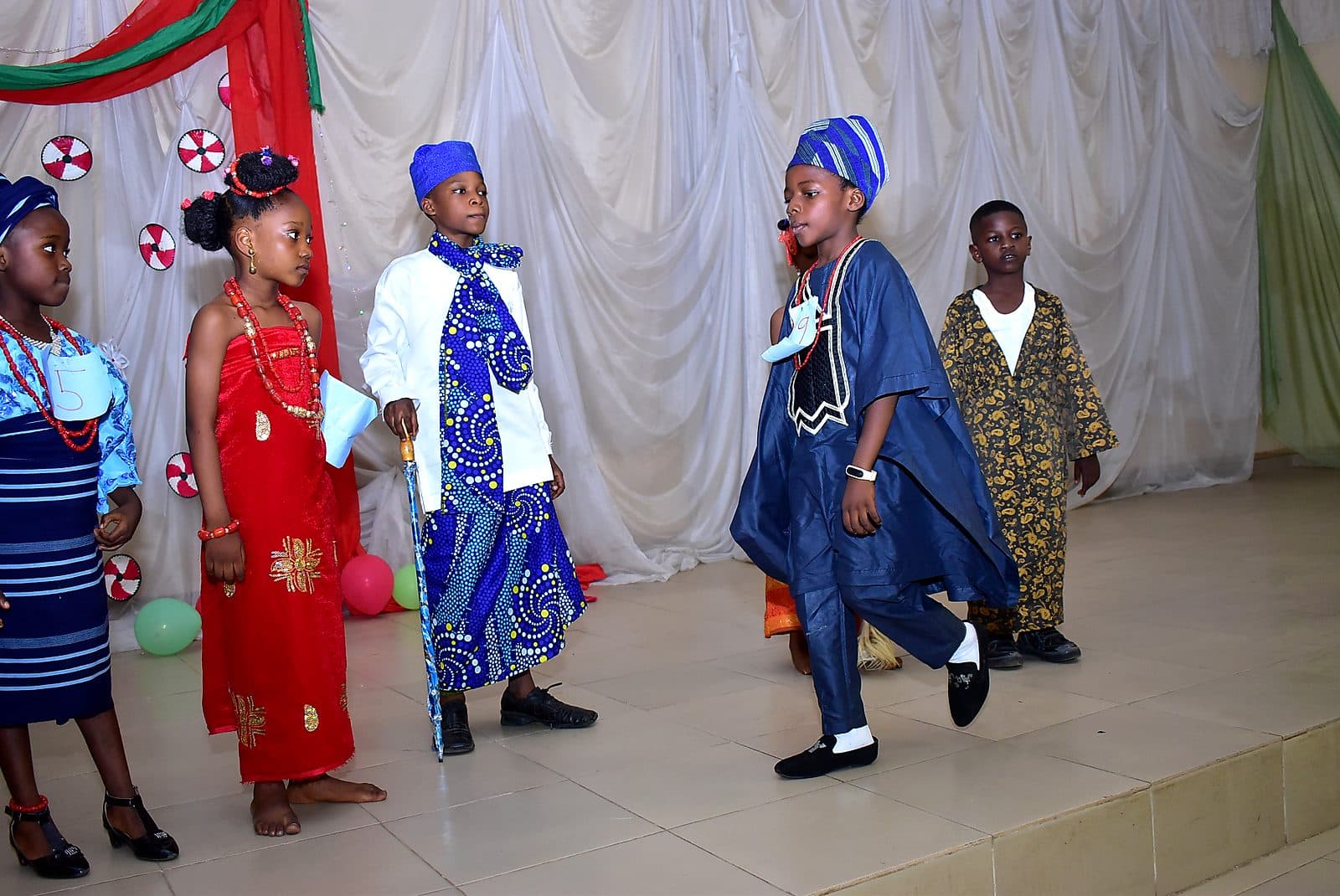 Pupils walking on in traditional dress