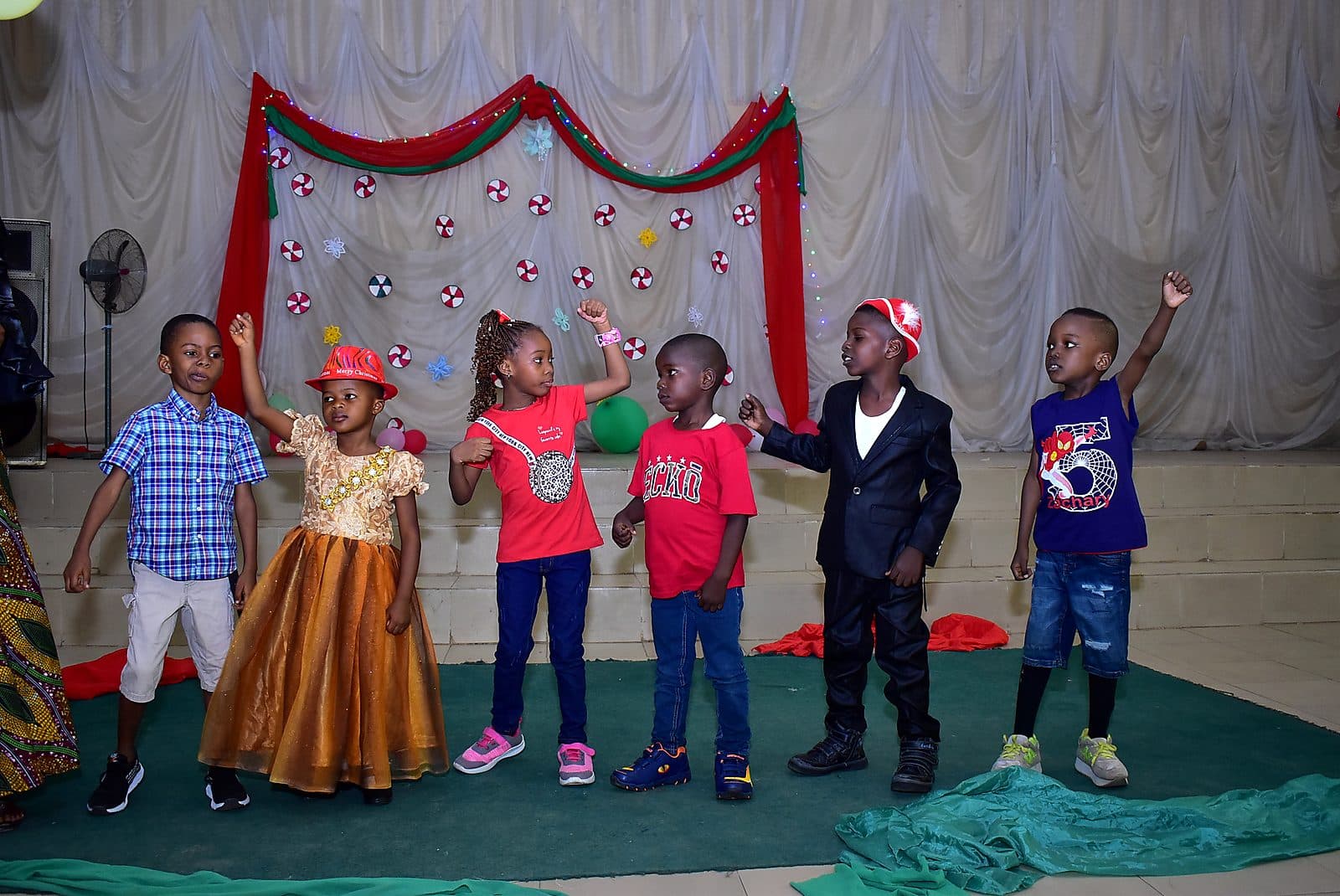 Pupils lined up on stage in costume