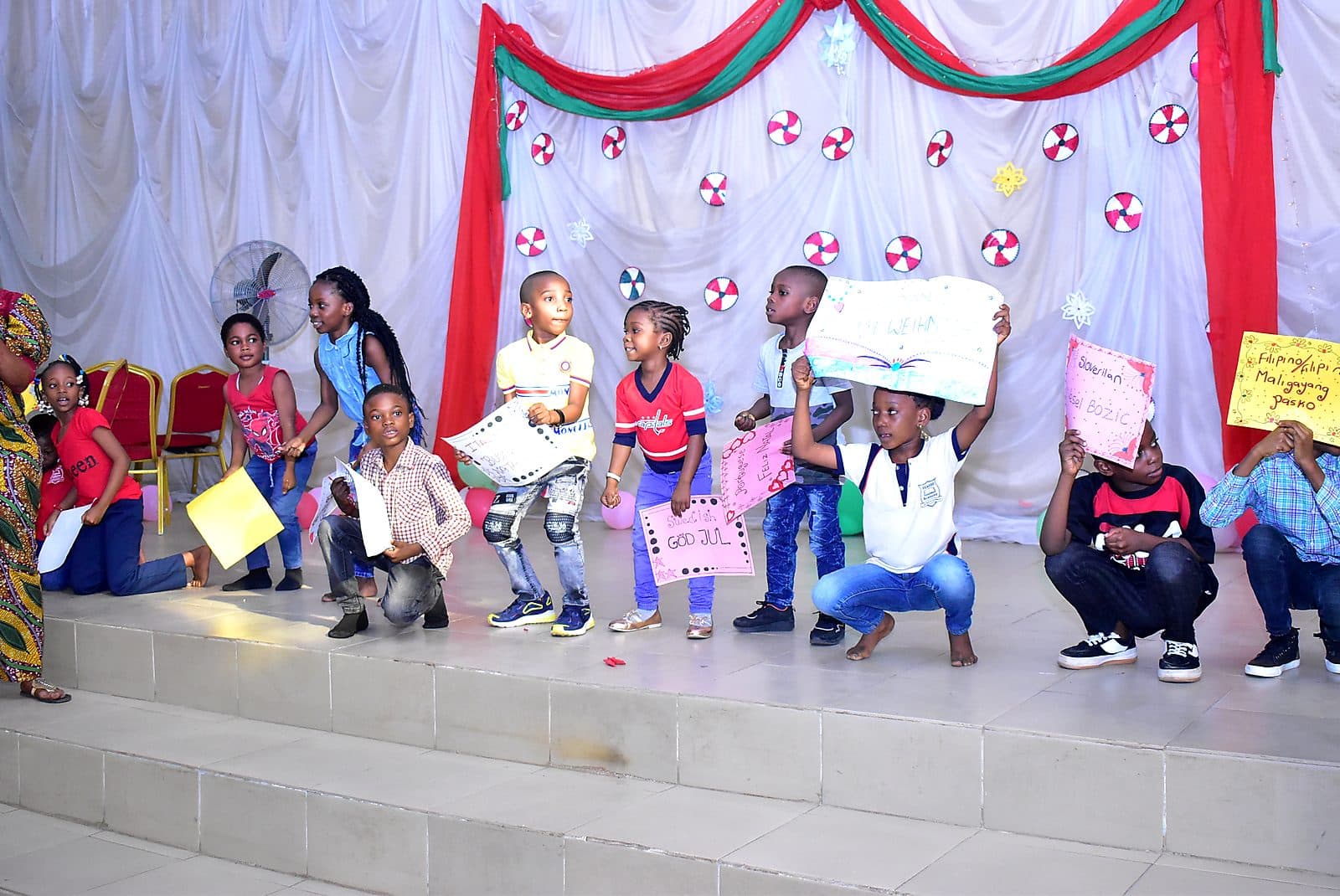 Pupils holding up their work during a presentation